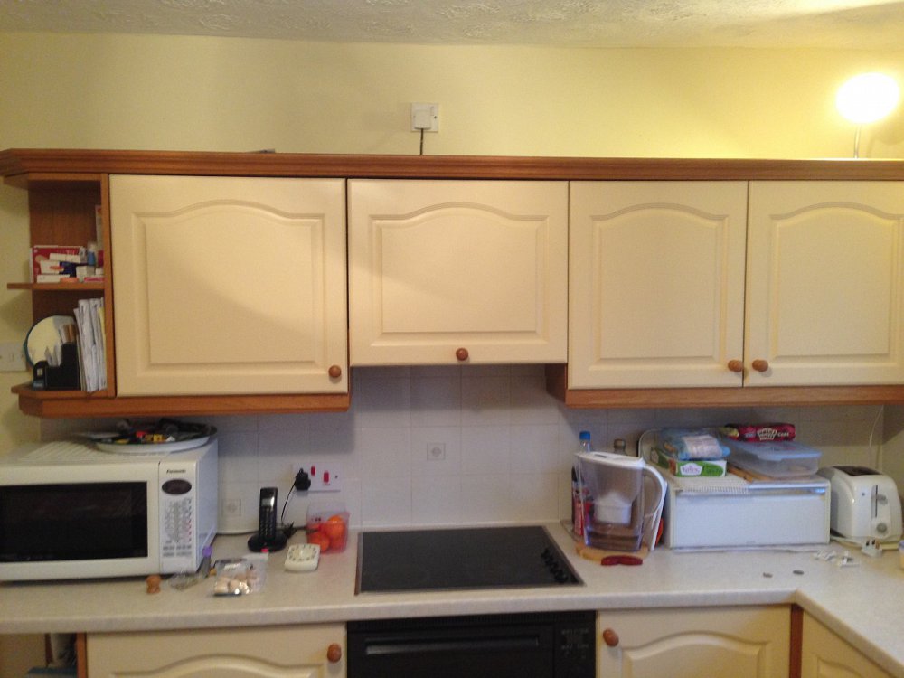 This was a job I carried out in Bramhall where we painted kitchen doors to match the natural wood used elsewhere in the kitchen.