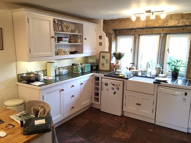 After. The resprayed kitchen in Farrow and Ball’s Wevet colour.