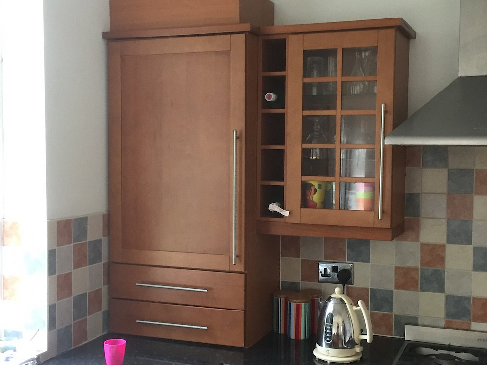 Resprayed stained cherry kitchen in Bramhall - Before