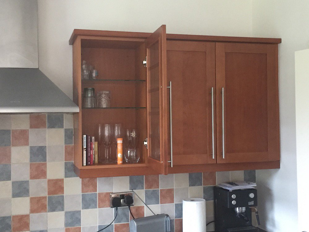 Resprayed stained cherry kitchen in Bramhall - Before
