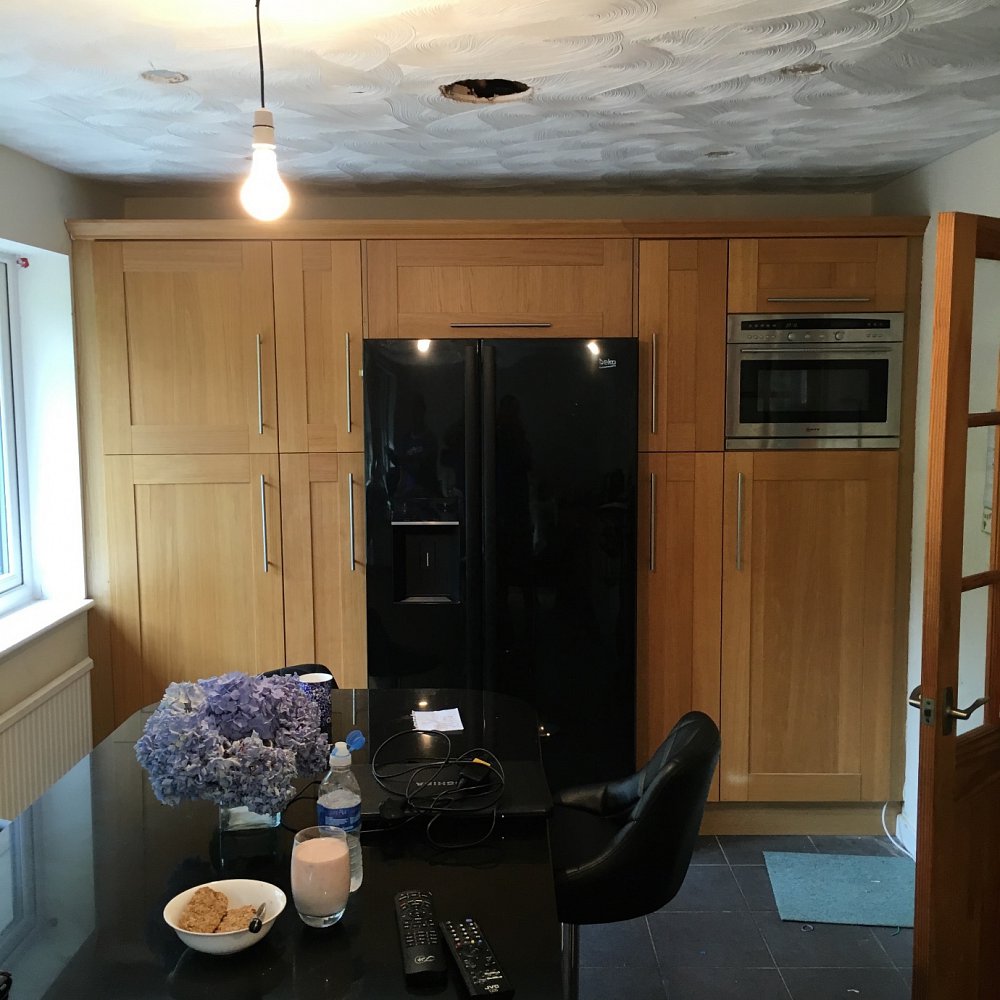 Light oak shaker kitchen units before.